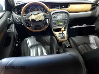 2003 Jaguar X-Type 3.0L z VIN SAJEA51C33WD25630, wystawiony jako Copart lot #57795475 z przebiegiem 135 514 mil mil oraz Szkody całkowita. Historia ofert i sprzedaży dostępna na DreamBid. Obrazek 8.