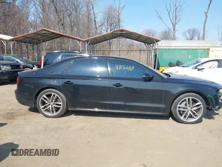 2017 Audi A8 with VIN WAU44AFDXHN004395, listed as a IAAI auction lot 41705688 with 63,282 mi miles and . Bid and sale history available at DreamBid. Image 13.