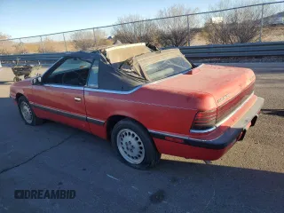 1989 Chrysler LeBaron z VIN 1C3XJ45K0KG251502, wystawiony jako Copart lot #87112404 z przebiegiem 166 445 mil mil oraz Tytuł czysty. Historia ofert i sprzedaży dostępna na DreamBid. Obrazek 2.