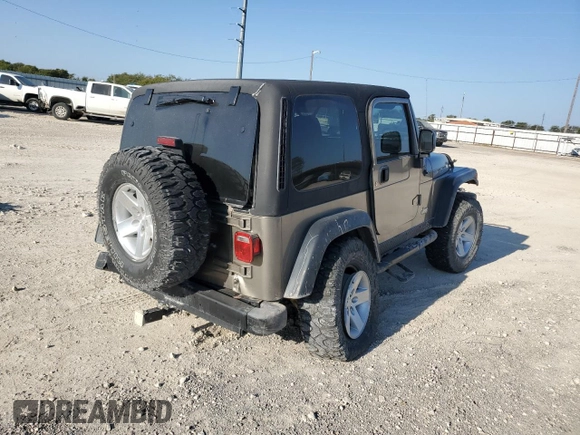 2003 Jeep Wrangler Rubicon with VIN 1J4FA69S73P339925, listed as a Copart auction lot 75341094 with Not provided miles and Salvage title. Bid and sale history available at DreamBid. Image 3.