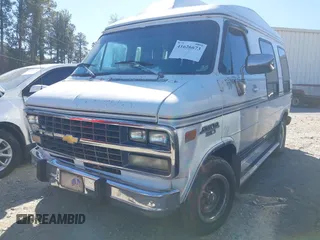 1993 Chevrolet Chevy Van z VIN 2GBEG25Z3P4134393, wystawiony jako IAAI lot #41626673 z przebiegiem 214 306 mil mil oraz . Historia ofert i sprzedaży dostępna na DreamBid. Obrazek 2.