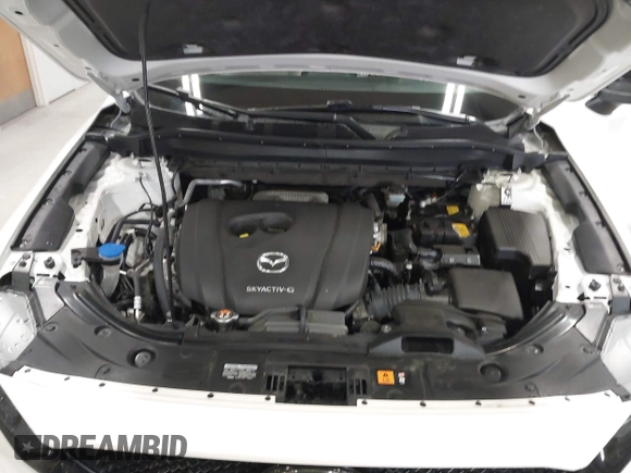 2020 Mazda CX-5 Grand Touring with VIN JM3KFBDM6L1828611, listed as a IAAI auction lot 42006976 with 59,939 mi miles and . Bid and sale history available at DreamBid. Image 10.
