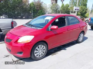 2009 Toyota Yaris with VIN JTDBT903591342243, listed as a IAAI auction lot 42104557 with 407,106 mi miles. Bid and sale history available at carsss.com. Image 2.