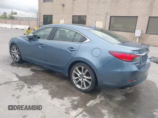 2014 Mazda 6 i Grand Touring with VIN JM1GJ1W64E1133729, listed as a IAAI auction lot 42050222 with 112,464 mi miles and . Bid and sale history available at DreamBid. Image 3.