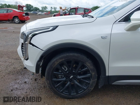 2022 Cadillac XT4 AWD Premium Luxury z VIN 1GYFZDR42NF128199, wystawiony jako IAAI lot #42522314 z przebiegiem 29 002 mil mil oraz . Historia ofert i sprzedaży dostępna na DreamBid. Obrazek 17.