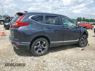 2018 Honda CR-V Touring with VIN 2HKRW2H9XJH605264, listed as a Copart auction lot 61500315 with 106,616 mi miles and Salvage title. Bid and sale history available at DreamBid. Image 3.