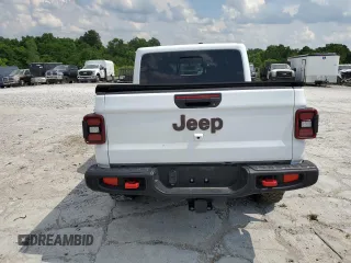 2021 Jeep Gladiator Rubicon z VIN 1C6JJTBG0ML624275, wystawiony jako Copart lot #62840275 z przebiegiem Nie podano mil oraz Szkoda całkowita • Salvage title. Historia ofert i sprzedaży dostępna na DreamBid. Obrazek 6.