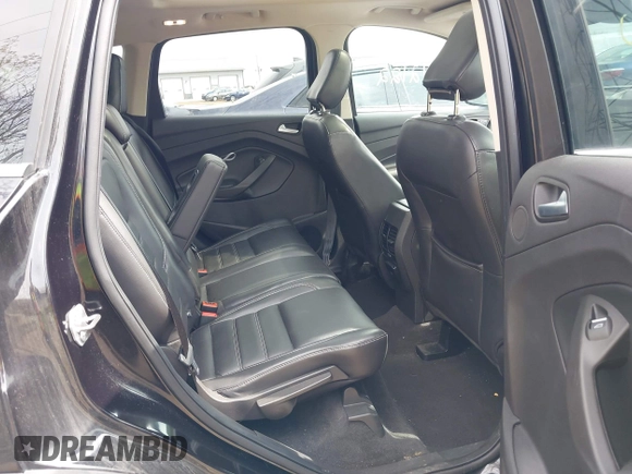2019 Ford Escape Titanium with VIN 1FMCU9J91KUC42161, listed as a IAAI auction lot 41942122 with 100,677 mi miles and . Bid and sale history available at DreamBid. Image 8.