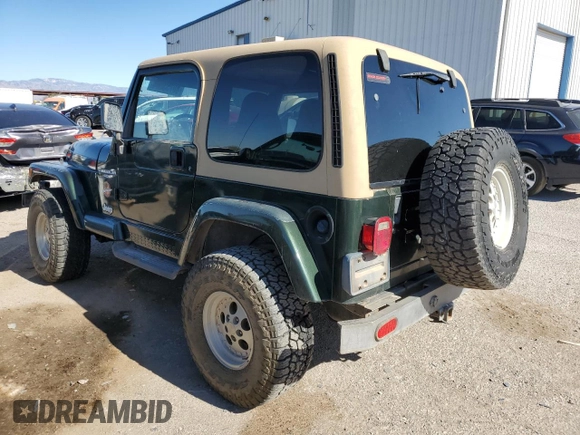 1997 Jeep Wrangler Sahara with VIN 1J4FY49S6VP521988, listed as a Copart auction lot 80753494 with 99,909 mi miles and Salvage Title. Bid and sale history available at carsss.com. Image 2.