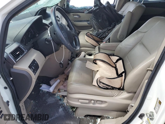 2014 Honda Odyssey Touring with VIN 5FNRL5H98EB053486, listed as a Copart auction lot 58004225 with 201,526 mi miles and Salvage title. Bid and sale history available at DreamBid. Image 7.