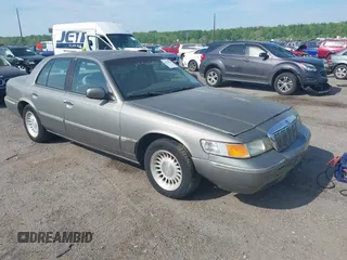 2000 Mercury Grand Marquis LS z VIN 2MEFM75WXYX671286, wystawiony jako IAAI lot #42158291 z przebiegiem 87 223 mil mil oraz . Historia ofert i sprzedaży dostępna na DreamBid. Obrazek 1.