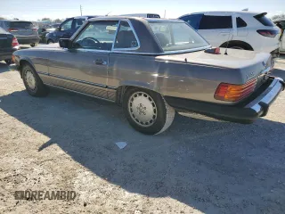 1987 Mercedes-Benz 560 with VIN WDBBA48D7HA063380, listed as a Copart auction lot 77820004 with 81,187 mi miles and Salvage Title. Bid and sale history available at carsss.com. Image 2.