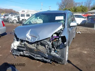 2012 Toyota Sienna XLE with VIN 5TDDK3DC6CS045009, listed as a IAAI auction lot 41790571 with 154,817 mi miles. Bid and sale history available at carsss.com. Image 2.