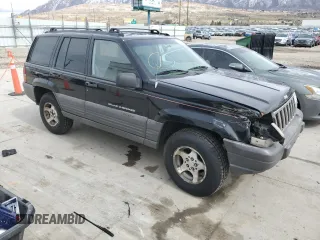 1996 Jeep Grand Cherokee with VIN 1J4EZ58S8TC106529, listed as a Copart auction lot 50163965 with 226,951 mi miles and Salvage title. Bid and sale history available at DreamBid. Image 4.