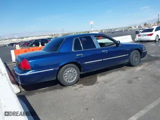 2004 Mercury Grand Marquis GS with VIN 2MEFM74W94X632233, listed as a IAAI auction lot 42051360 with 167,654 mi miles. Bid and sale history available at carsss.com. Image 4.