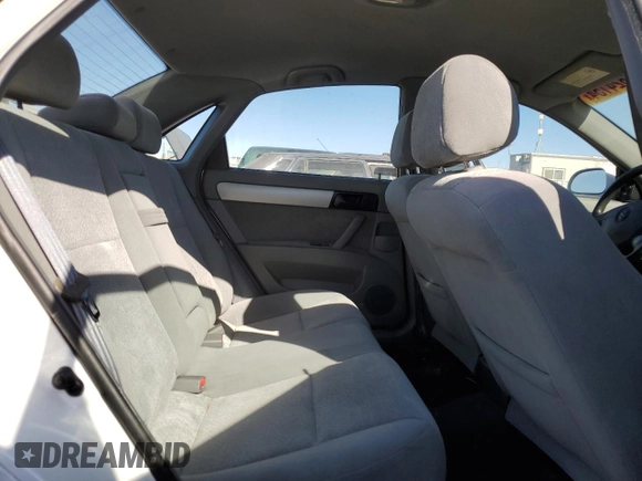 2004 Suzuki Forenza S z VIN KL5JD52Z14K950658, wystawiony jako Copart lot #74824154 z przebiegiem 99 150 mil mil oraz Tytuł czysty. Historia ofert i sprzedaży dostępna na DreamBid. Obrazek 10.