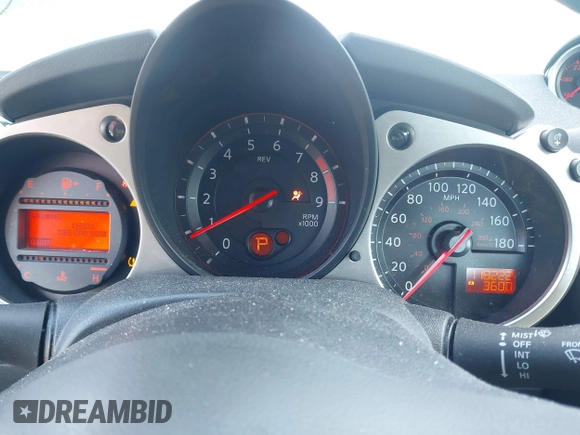 2013 Nissan 370Z z VIN JN1AZ4EH4DM380820, wystawiony jako IAAI lot #41547638 z przebiegiem 118 222 mil mil oraz . Historia ofert i sprzedaży dostępna na DreamBid. Obrazek 7.