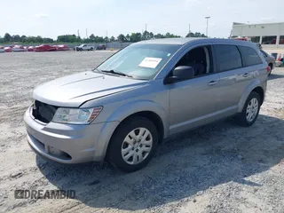 2015 Dodge Journey SE z VIN 3C4PDCAB0FT698674, wystawiony jako IAAI lot #42308994 z przebiegiem 97 640 mil mil oraz . Historia ofert i sprzedaży dostępna na DreamBid. Obrazek 2.
