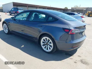 2022 Tesla Model 3 with VIN 5YJ3E1EA6NF144098, listed as a IAAI auction lot 41965360 with 75,597 mi miles. Bid and sale history available at carsss.com. Image 3.