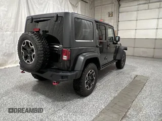 2014 Jeep Wrangler Unlimited Rubicon X with VIN 1C4HJWFG2EL312737, listed as a Copart auction lot 56547735 with 121,477 mi miles and Clean title. Bid and sale history available at DreamBid. Image 4.