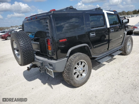 2003 Hummer H2 with VIN 5GRGN23U33H102570, listed as a Copart auction lot 77259654 with 0 mi miles and Salvage Title. Bid and sale history available at carsss.com. Image 3.