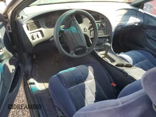 1997 Ford Thunderbird LX z VIN 1FALP62W2VH171912, wystawiony jako Copart lot #65073454 z przebiegiem 179 439 mil mil oraz Szkoda całkowita • Salvage title. Historia ofert i sprzedaży dostępna na DreamBid. Obrazek 8.