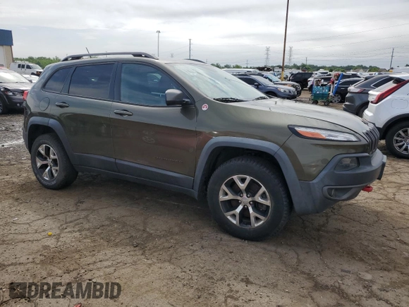 2015 Jeep Cherokee Trailhawk with VIN 1C4PJMBSXFW545534, listed as a Copart auction lot 62236885 with 148,448 mi miles and Clean title. Bid and sale history available at DreamBid. Image 4.