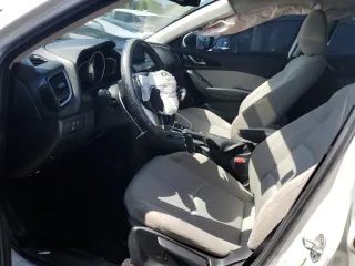 2016 Mazda 3 i Touring z VIN JM1BM1W70G1299548, wystawiony jako Copart lot #52575085 z przebiegiem 136 964 mil mil oraz Szkoda całkowita • Salvage title. Historia ofert i sprzedaży dostępna na DreamBid. Obrazek 7.