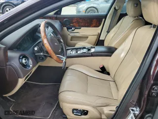 2013 Jaguar XJ with VIN SAJWA2G12DLV57581, listed as a Copart auction lot 84736054 with 91,779 mi miles and Salvage Title. Bid and sale history available at carsss.com. Image 7.