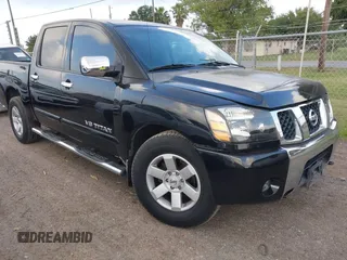 2006 Nissan Titan LE z VIN 1N6BA07A56N549092, wystawiony jako IAAI lot #42453900 z przebiegiem 168 593 mil mil oraz . Historia ofert i sprzedaży dostępna na DreamBid. Obrazek 1.