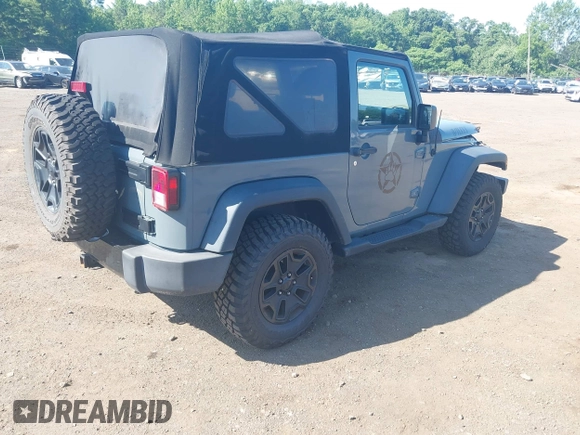 2015 Jeep Wrangler Freedom Edition with VIN 1C4AJWAG1FL714002, listed as a IAAI auction lot 42579024 with 98,732 mi miles and . Bid and sale history available at DreamBid. Image 4.