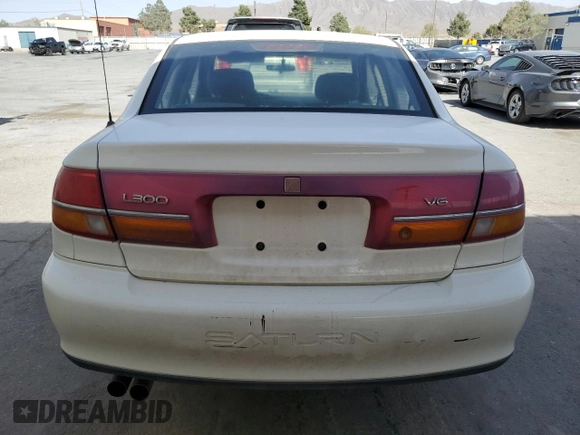 2002 Saturn LS z VIN 1G8JW54R72Y576434, wystawiony jako Copart lot #55029305 z przebiegiem 135 613 mil mil oraz Szkody całkowita. Historia ofert i sprzedaży dostępna na DreamBid. Obrazek 6.