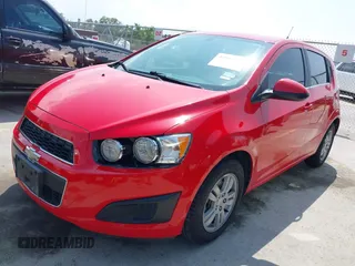 2014 Chevrolet Sonic LT with VIN 1G1JC6SH7E4135650, listed as a IAAI auction lot 41954694 with 103,944 mi miles. Bid and sale history available at carsss.com. Image 2.