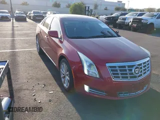 2013 Cadillac XTS Luxury z VIN 2G61P5S3XD9115546, wystawiony jako IAAI lot #41980135 z przebiegiem 104 609 mil mil oraz . Historia ofert i sprzedaży dostępna na DreamBid. Obrazek 1.