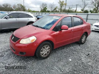 2012 Suzuki SX4 LE with VIN JS2YC5A39C6300577, listed as a Copart auction lot 86998944 with 103,354 mi miles and Non Repairable. Bid and sale history available at carsss.com. Image 1.