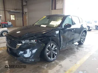 2023 Mazda CX-5 S Premium Plus z VIN JM3KFBEM8P0130642, wystawiony jako IAAI lot #41879316 z przebiegiem Nie podano mil oraz . Historia ofert i sprzedaży dostępna na DreamBid. Obrazek 2.