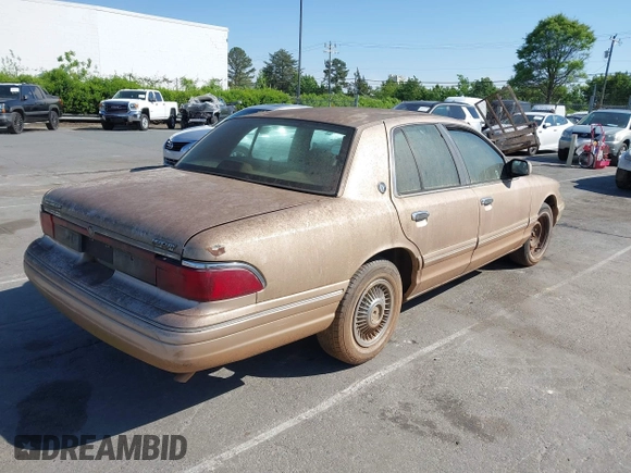 1996 Mercury Grand Marquis GS with VIN 2MELM74W3TX670994, listed as a IAAI auction lot 42052604 with 46,728 mi miles and . Bid and sale history available at DreamBid. Image 4.