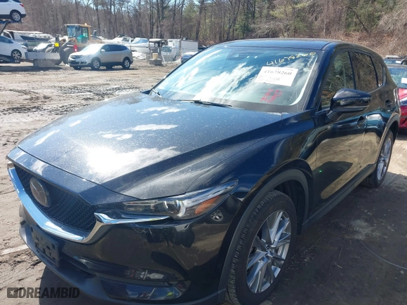 2021 Mazda CX-5 Grand Touring with VIN JM3KFBDM3M1318248, listed as a IAAI auction lot 41678260 with 71,903 mi miles. Bid and sale history available at carsss.com. Image 17.