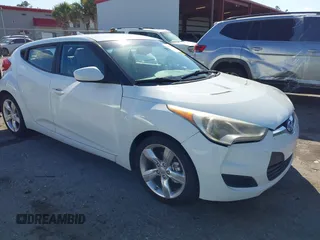 2013 Hyundai Veloster w/Black Int with VIN KMHTC6AD8DU086533, listed as a IAAI auction lot 41704330 with 88,297 mi miles and . Bid and sale history available at DreamBid. Image 1.