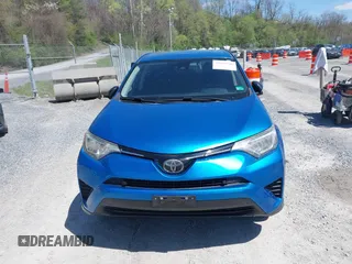 2018 Toyota RAV4 LE with VIN JTMZFREV4JJ734702, listed as a IAAI auction lot 41987540 with 141,526 mi miles. Bid and sale history available at carsss.com. Image 12.