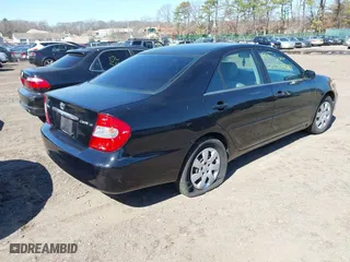 2003 Toyota Camry LE with VIN 4T1BE32K93U134041, listed as a IAAI auction lot 41834634 with 999,999 mi miles. Bid and sale history available at carsss.com. Image 4.