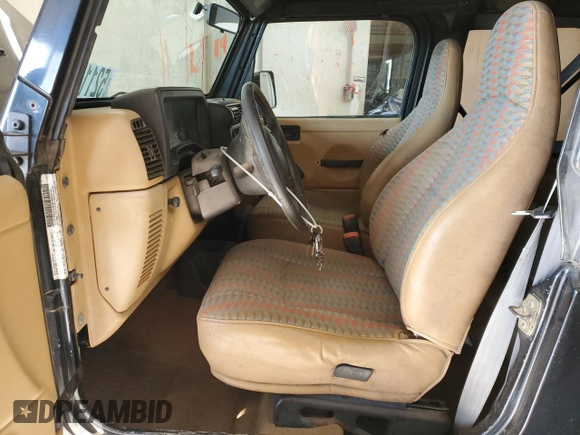 1997 Jeep Wrangler Sport with VIN 1J4FY19S6VP457417, listed as a Copart auction lot 52110535 with 106,129 mi miles and Salvage Title. Bid and sale history available at carsss.com. Image 7.