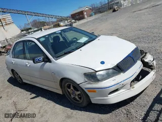 2002 Mitsubishi Lancer OZ-Rally with VIN JA3AJ86E42U039140, listed as a IAAI auction lot 41853888 with 328,181 mi miles. Bid and sale history available at carsss.com. Image 1.
