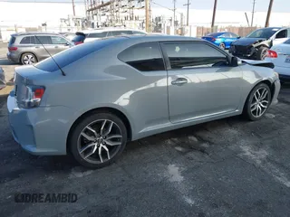 2014 Scion tC with VIN JTKJF5C7XE3079765, listed as a IAAI auction lot 41210220 with 114,410 mi miles. Bid and sale history available at carsss.com. Image 4.