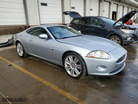 2007 Jaguar XK with VIN SAJWA43B775B07074, listed as a Copart auction lot 86350144 with 117,915 mi miles and Salvage Title. Bid and sale history available at carsss.com. Image 4.