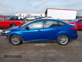 2018 Ford Focus SE z VIN 1FADP3F2XJL293337, wystawiony jako IAAI lot #42121294 z przebiegiem 71 241 mil mil oraz . Historia ofert i sprzedaży dostępna na DreamBid. Obrazek 14.