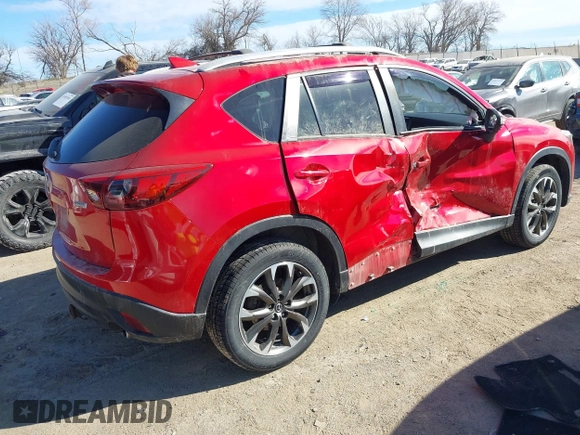 2016 Mazda CX-5 Grand Touring with VIN JM3KE4DY0G0709563, listed as a IAAI auction lot 41886956 with 156,769 mi miles. Bid and sale history available at carsss.com. Image 4.
