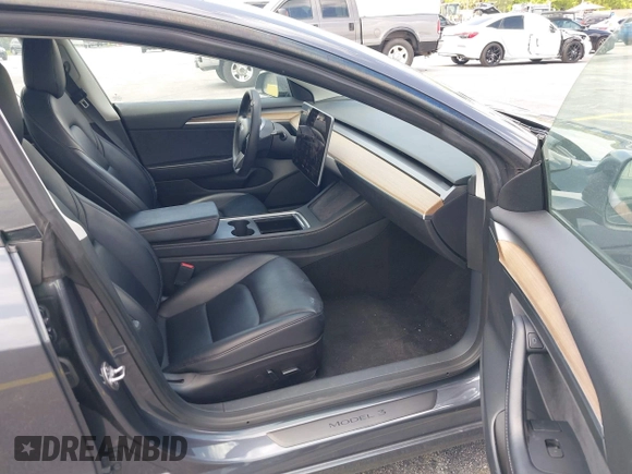 2023 Tesla Model 3 z VIN 5YJ3E1EA3PF435158, wystawiony jako IAAI lot #42356031 z przebiegiem 41 408 mil mil oraz . Historia ofert i sprzedaży dostępna na DreamBid. Obrazek 5.