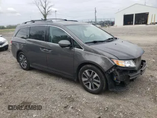 2014 Honda Odyssey Touring with VIN 5FNRL5H90EB014360, listed as a Copart auction lot 56699845 with 180,913 mi miles and Salvage title. Bid and sale history available at DreamBid. Image 4.