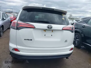 2018 Toyota RAV4 LE with VIN 2T3BFREVXJW793174, listed as a IAAI auction lot 42037936 with 82,304 mi miles. Bid and sale history available at carsss.com. Image 16.
